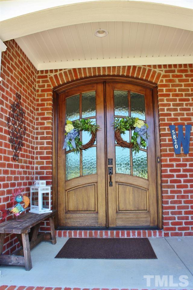 5820 Farmstead Road Bailey, NC 27807 - Photo 4 of 25 a view of an entryway with a table and chairs