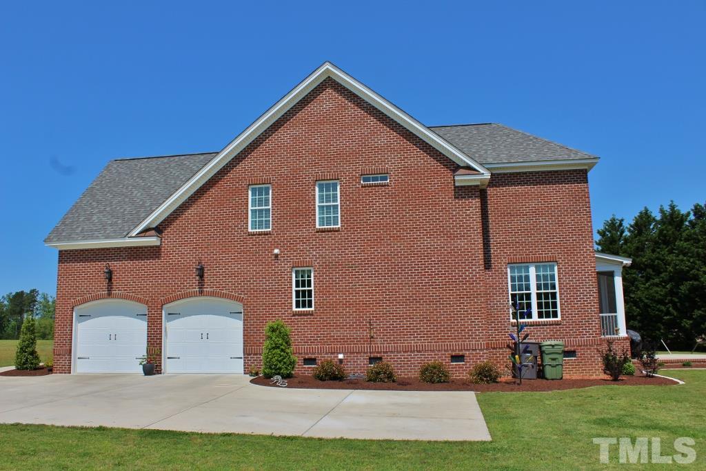 5820 Farmstead Road Bailey, NC 27807 - Photo 7 of 25 a front view of a house with a yard