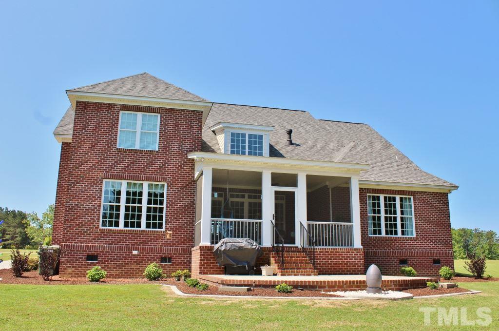 5820 Farmstead Road Bailey, NC 27807 - Photo 9 of 25 a front view of a house with yard and furniture