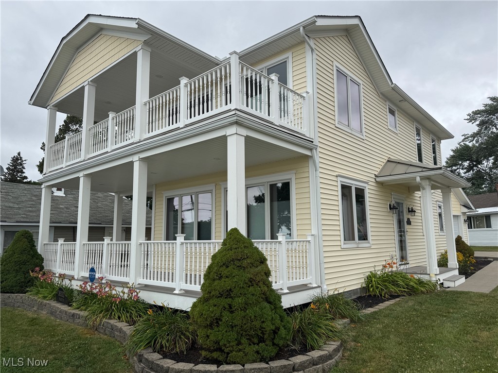 38332 Beachview Road Willoughby, OH 44094 - Photo 2 of 42 View of side of property with a balcony, covered porch entrance, and landscaping
