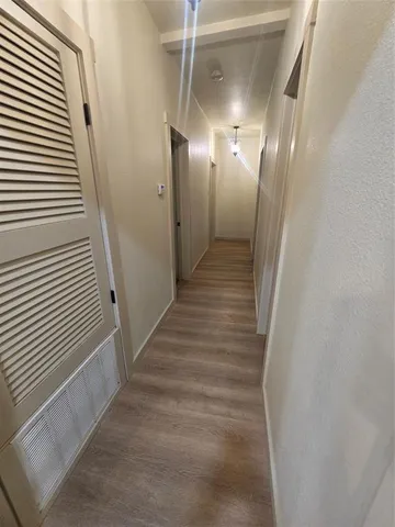 a kitchen with a refrigerator sink stove and cabinets