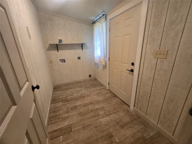 a view of a kitchen with a sink cabinet and a window