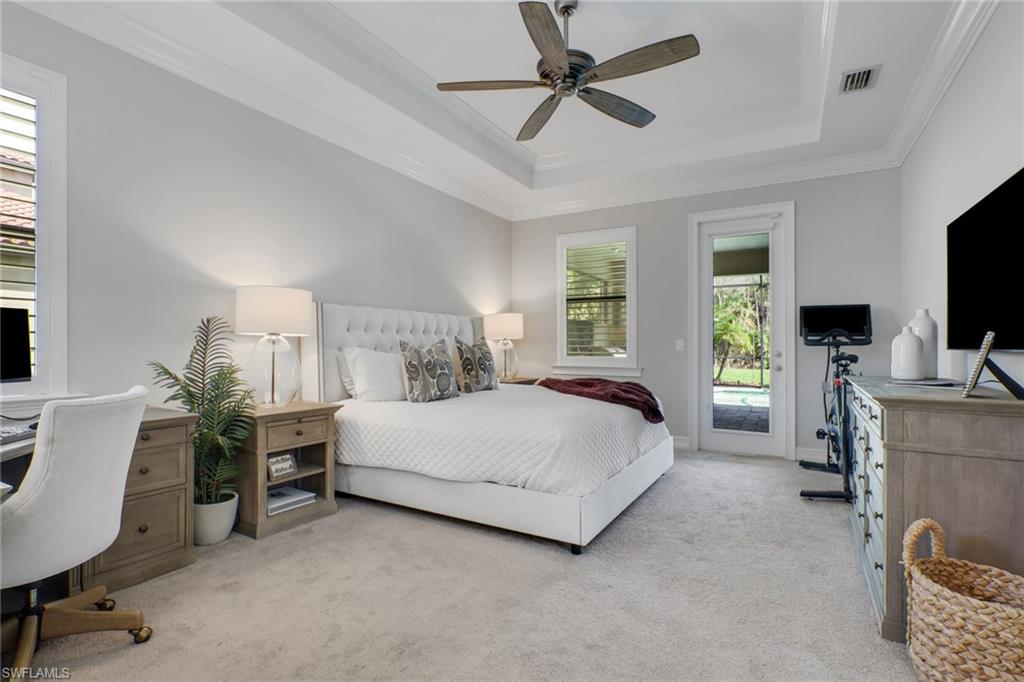 1511 Mockingbird Drive Naples, FL 34120 - Photo 17 of 44 a bedroom with a bed and a flat screen tv
