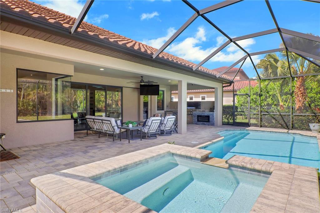 1511 Mockingbird Drive Naples, FL 34120 - Photo 2 of 44 a view of a house with backyard porch and sitting area