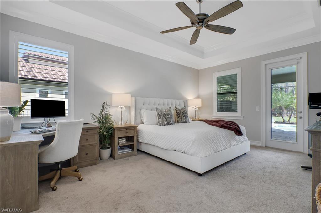 1511 Mockingbird Drive Naples, FL 34120 - Photo 21 of 44 a spacious bedroom with a bed and a desk