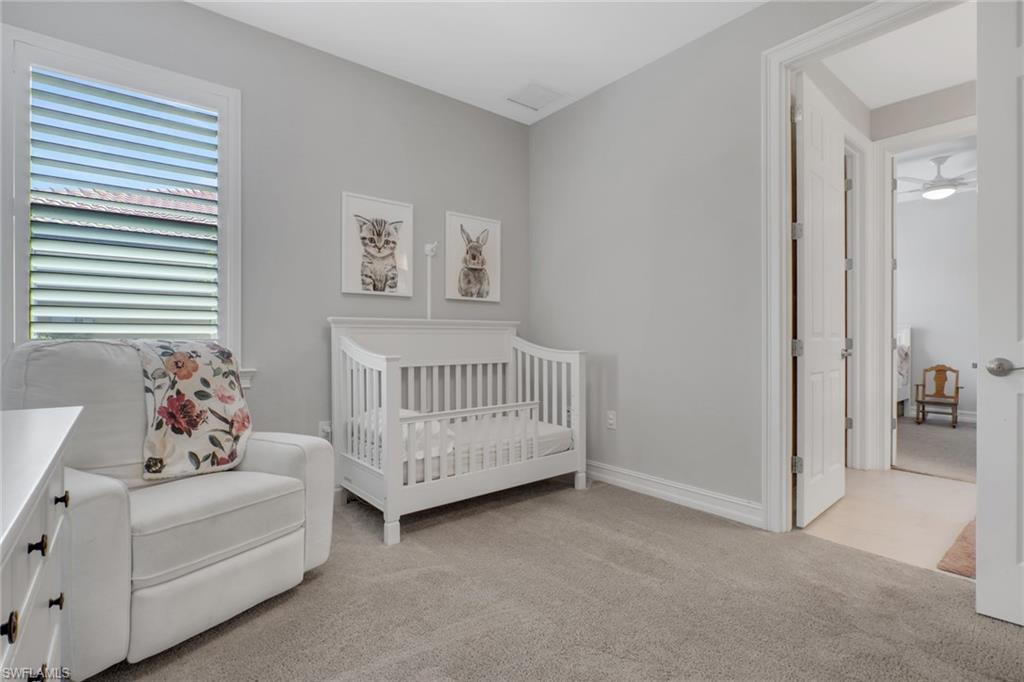 1511 Mockingbird Drive Naples, FL 34120 - Photo 25 of 44 a bedroom with furniture and a window