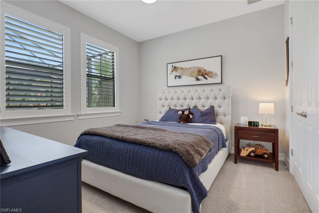 1511 Mockingbird Drive Naples, FL 34120 - Photo 28 of 44 a bedroom with a bed and a window