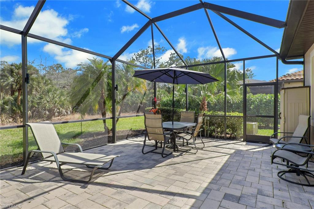 1511 Mockingbird Drive Naples, FL 34120 - Photo 37 of 44 a view of chairs and table in the patio