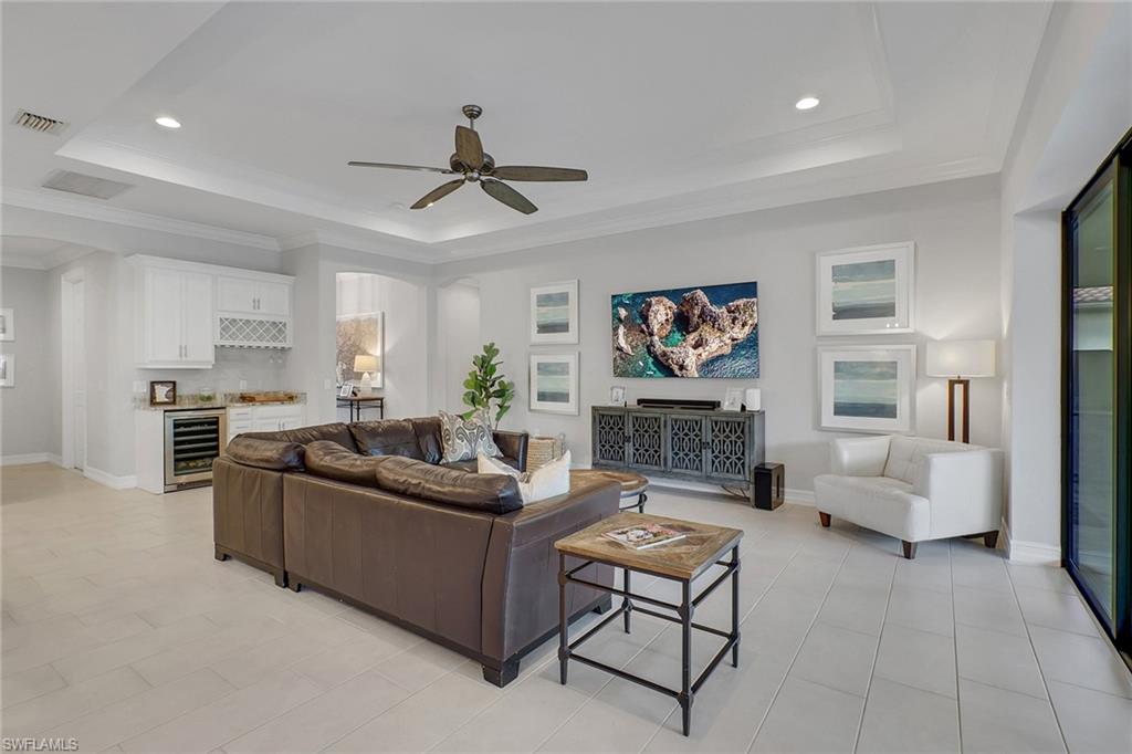 1511 Mockingbird Drive Naples, FL 34120 - Photo 4 of 44 a living room with furniture and a ceiling fan