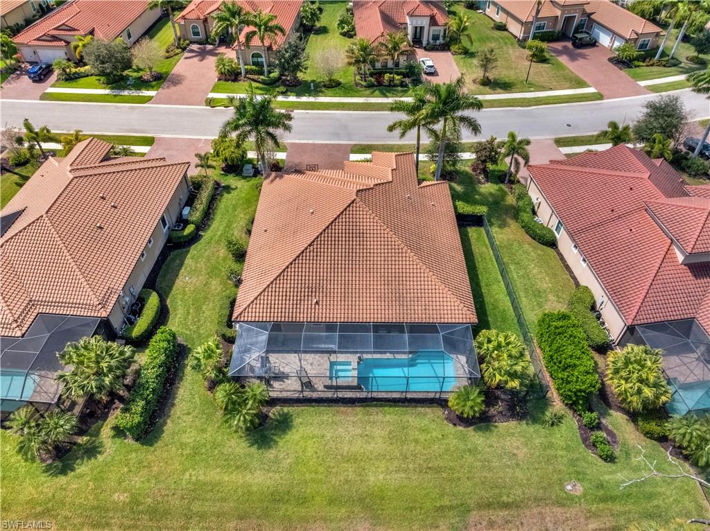 1511 Mockingbird Drive Naples, FL 34120 - Photo 43 of 44 an aerial view of a house with a garden and swimming pool