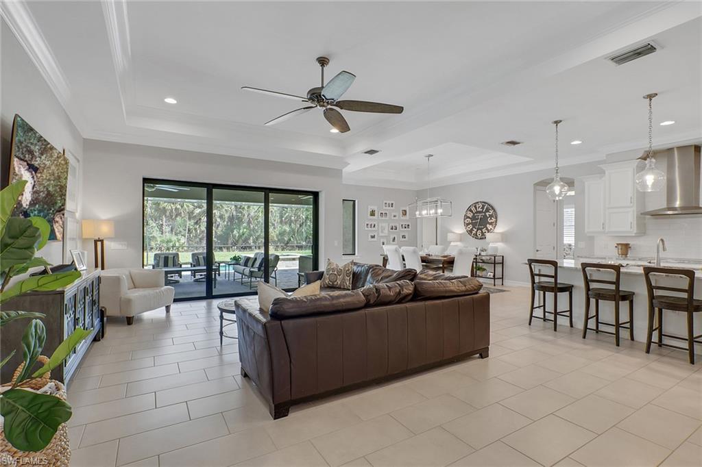 1511 Mockingbird Drive Naples, FL 34120 - Photo 5 of 44 a living room with furniture and a large window