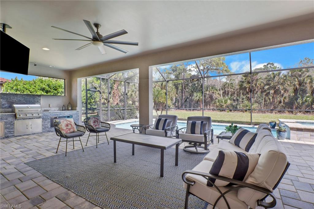 1511 Mockingbird Drive Naples, FL 34120 - Photo 6 of 44 a living room with furniture and a large window