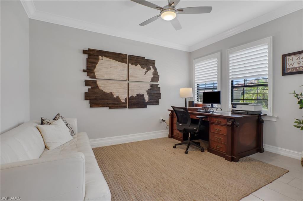 1511 Mockingbird Drive Naples, FL 34120 - Photo 8 of 44 a view of a workspace with furniture and a window