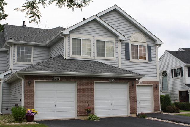 8251 Ripple Ridge Darien, IL 60561 - Photo 1 of 24 a front view of a house with a garage