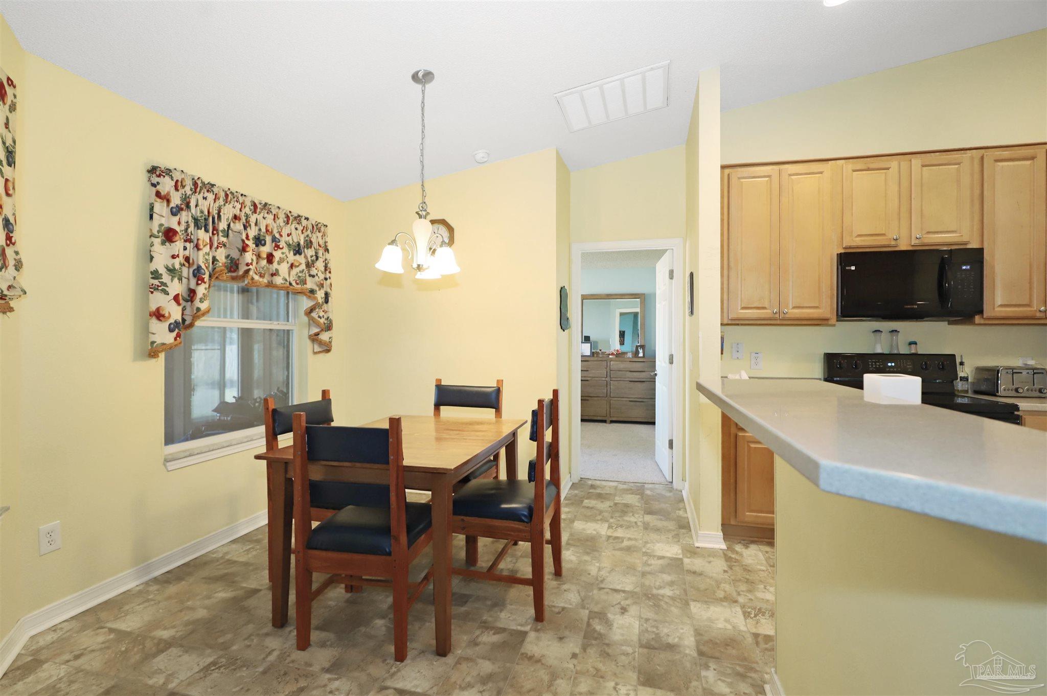 6006 Patch Lane Pensacola, FL 32526 - Photo 12 of 32 a view of a dining room and furniture