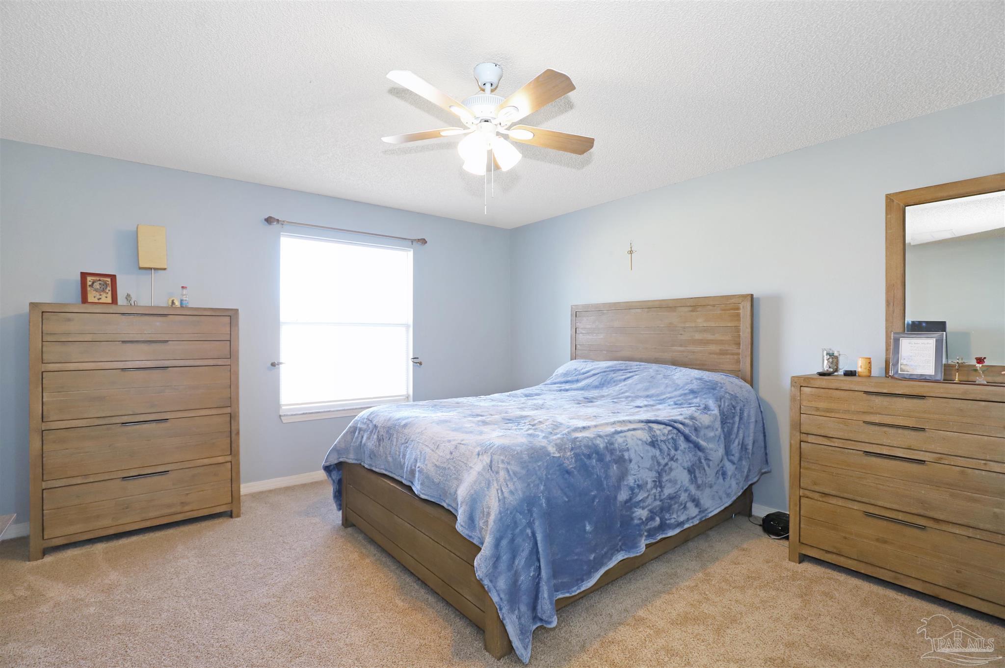 6006 Patch Lane Pensacola, FL 32526 - Photo 13 of 32 a bedroom with a bed and a dresser