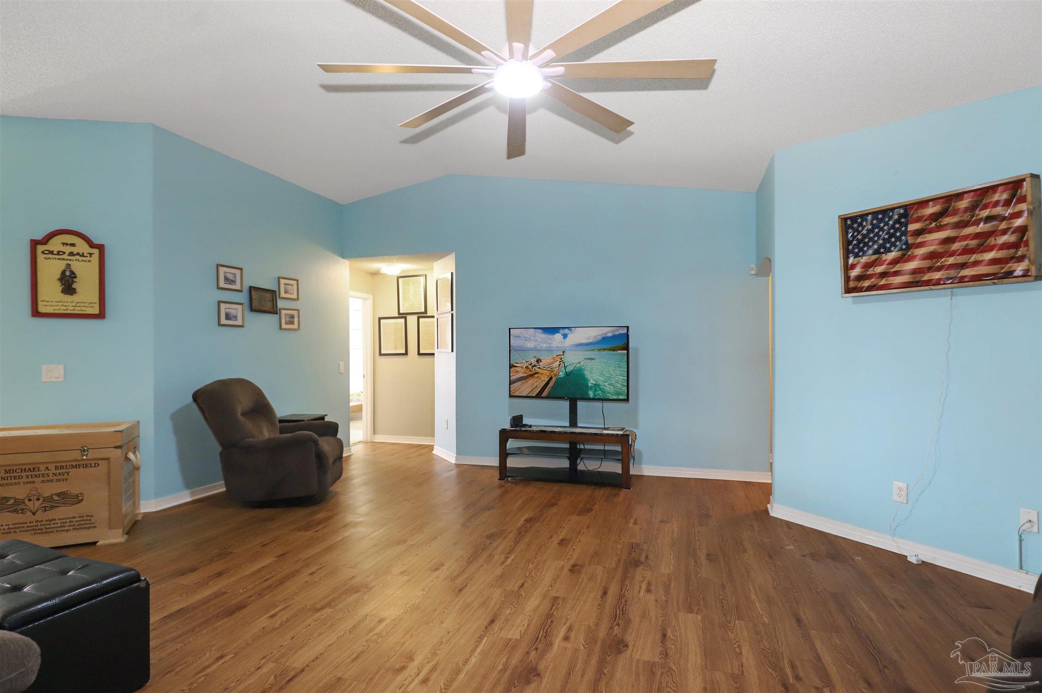 6006 Patch Lane Pensacola, FL 32526 - Photo 2 of 32 a living room with furniture and a flat screen tv