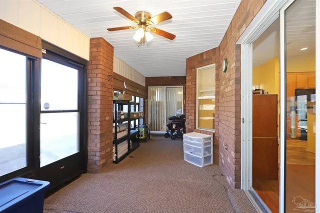 a view of a livingroom with furniture and a window