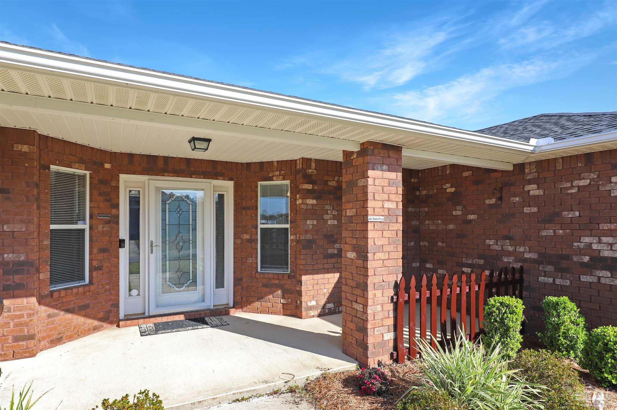 6006 Patch Lane Pensacola, FL 32526 - Photo 30 of 32 a front view of a building with glass door