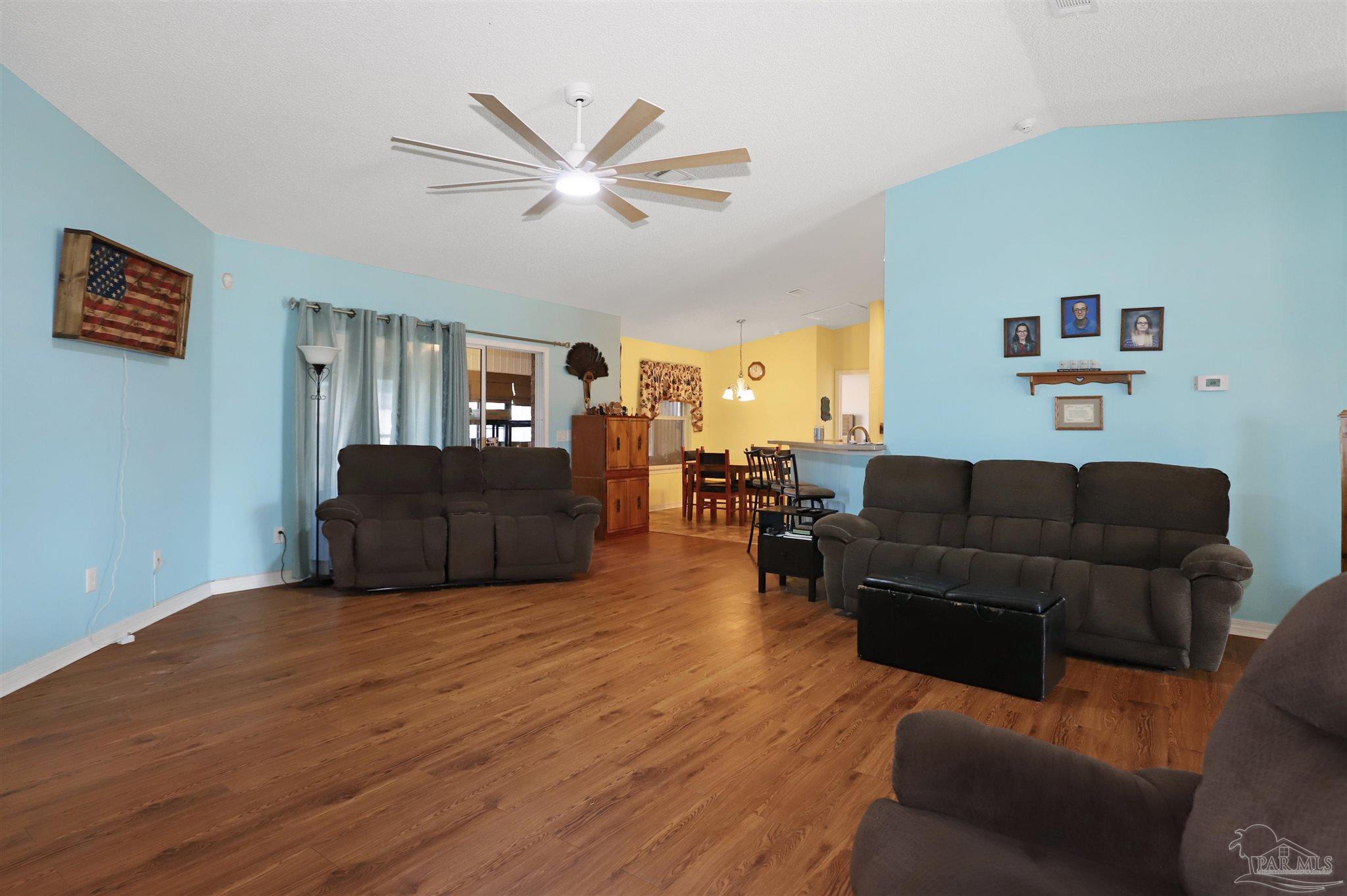 6006 Patch Lane Pensacola, FL 32526 - Photo 5 of 32 a living room with furniture and a view of kitchen