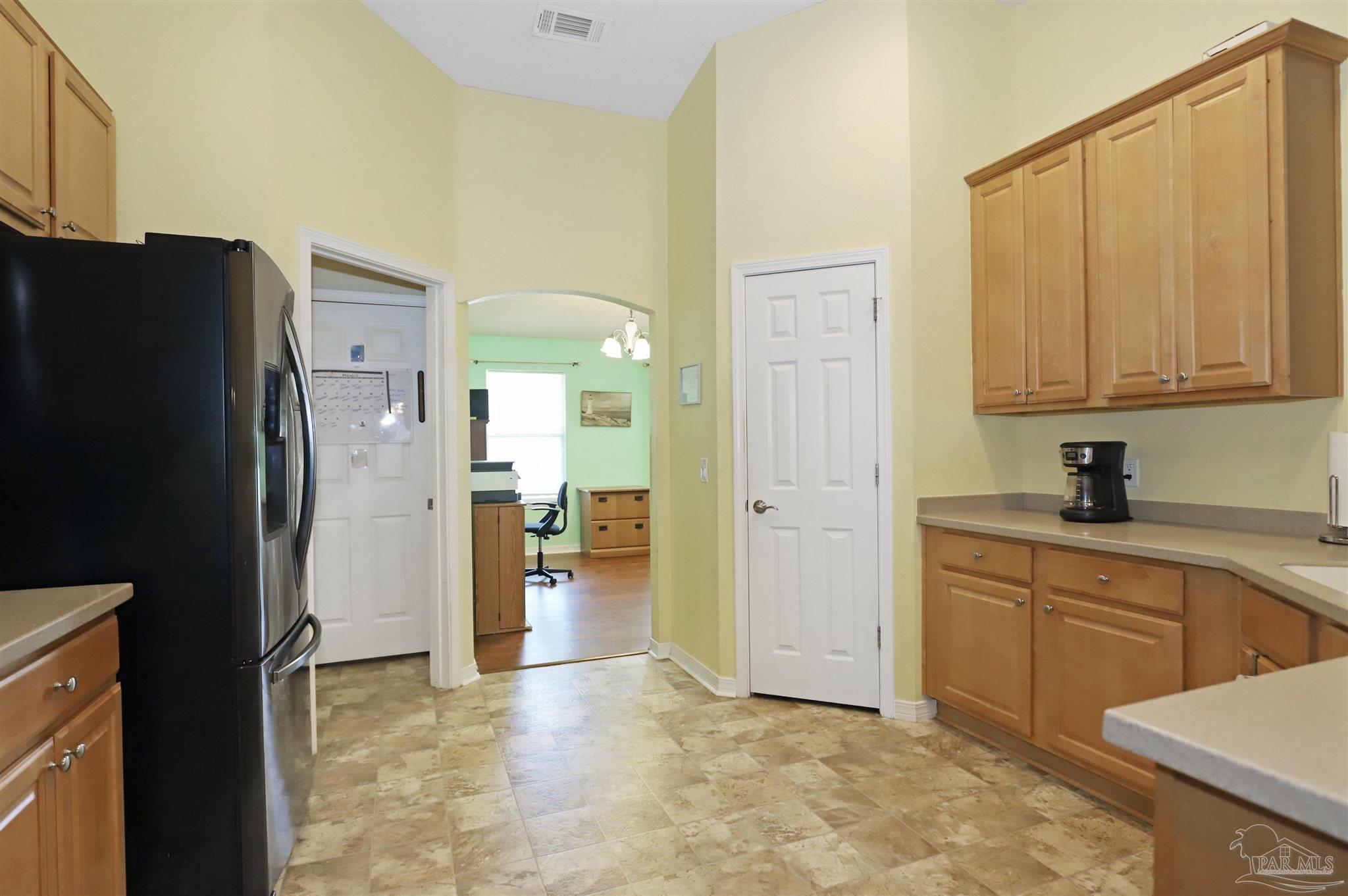 6006 Patch Lane Pensacola, FL 32526 - Photo 10 of 32 a view of a kitchen with a sink and refrigerator