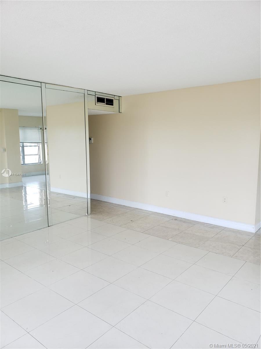4174 Inverrary Drive, Unit 702 Lauderhill, FL 33319 - Photo 1 of 17 an empty room with window in background