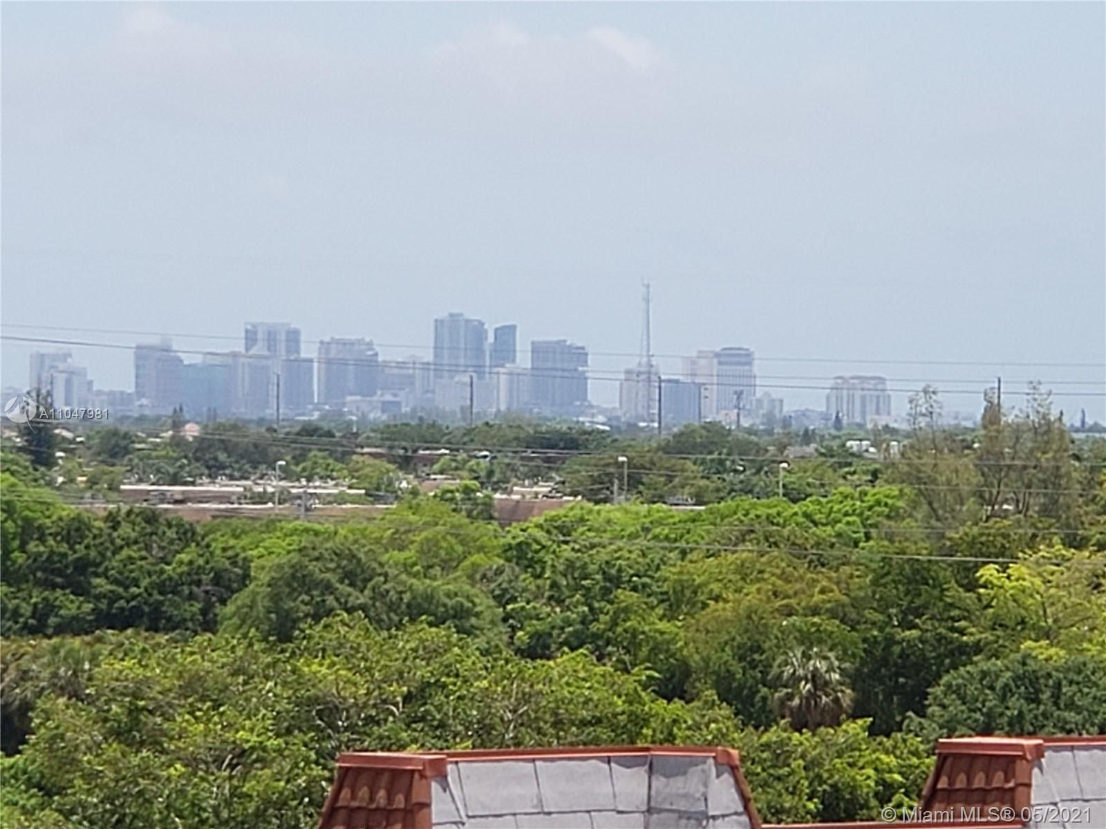 4174 Inverrary Drive, Unit 702 Lauderhill, FL 33319 - Photo 15 of 17 a view of a city with tall buildings
