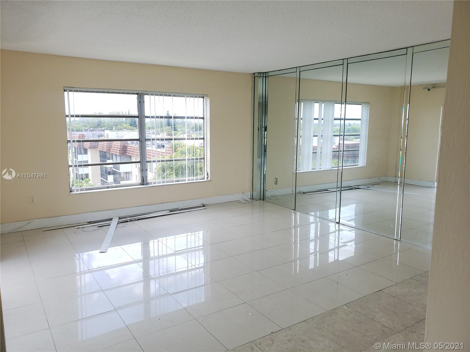 4174 Inverrary Drive, Unit 702 Lauderhill, FL 33319 - Photo 3 of 17 a view of an empty room with a window