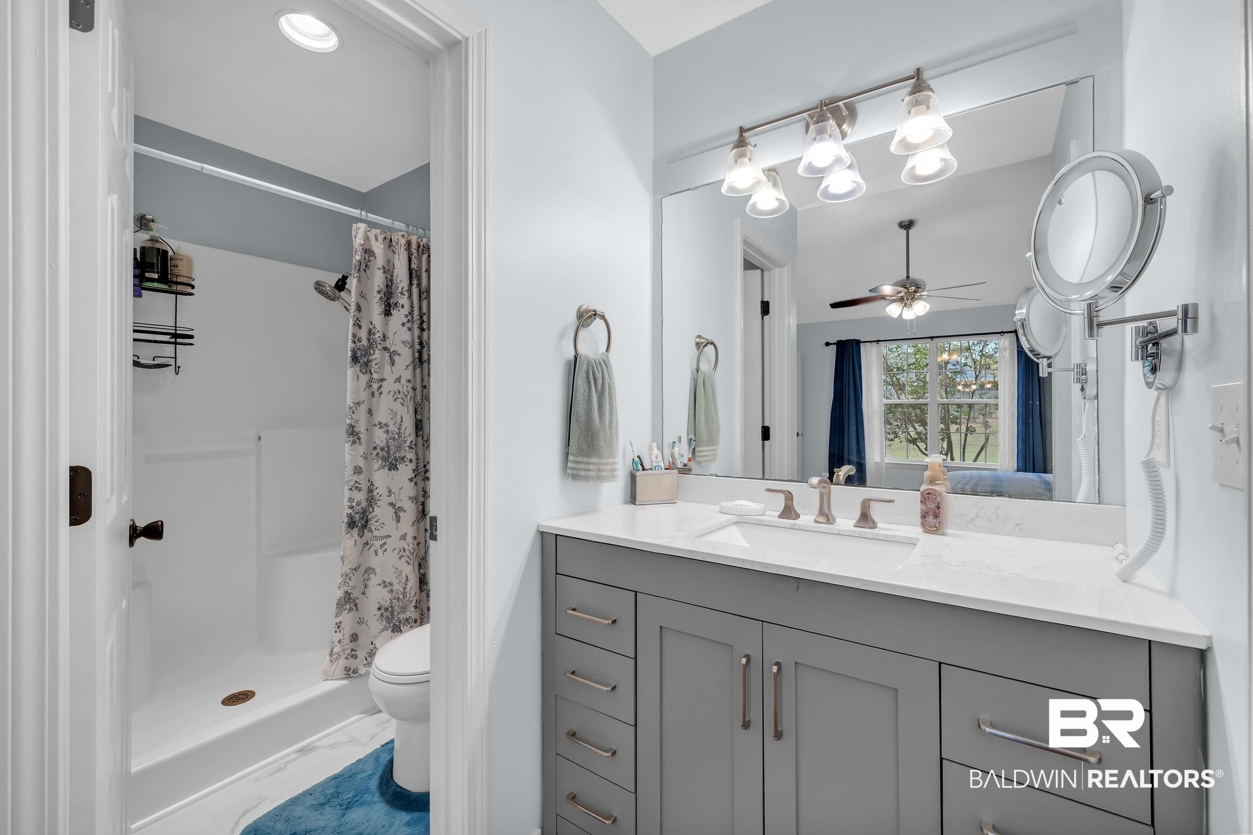 191 Robbins Boulevard Daphne, AL 36526 - Photo 12 of 24 Bathroom with vanity, a stall shower, and a ceiling fan