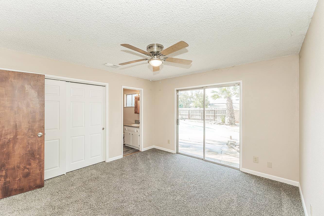 1375 South Cyrier Avenue Reedley, CA 93654 - Photo 15 of 34 an empty room with windows and fan