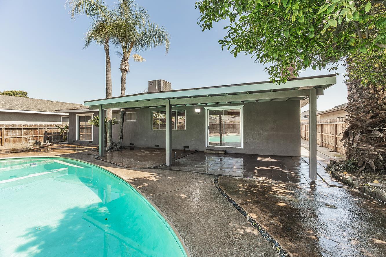 1375 South Cyrier Avenue Reedley, CA 93654 - Photo 26 of 34 a view of a house with a backyard and a patio