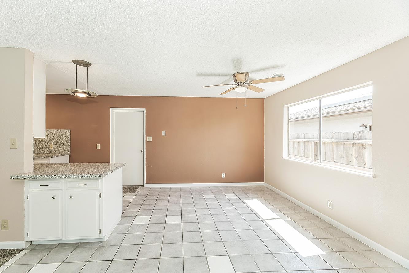 1375 South Cyrier Avenue Reedley, CA 93654 - Photo 7 of 34 a view of an empty room with a window