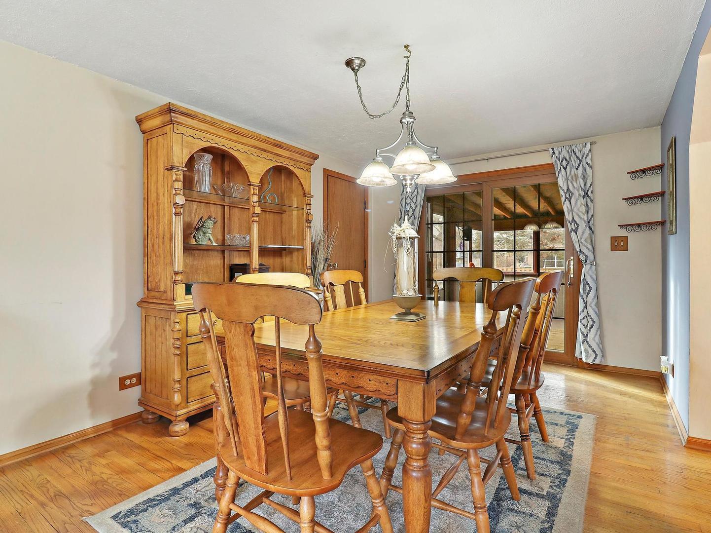 505 Kent Road McHenry, IL 60051 - Photo 9 of 21 a view of a dining room with furniture and wooden floor