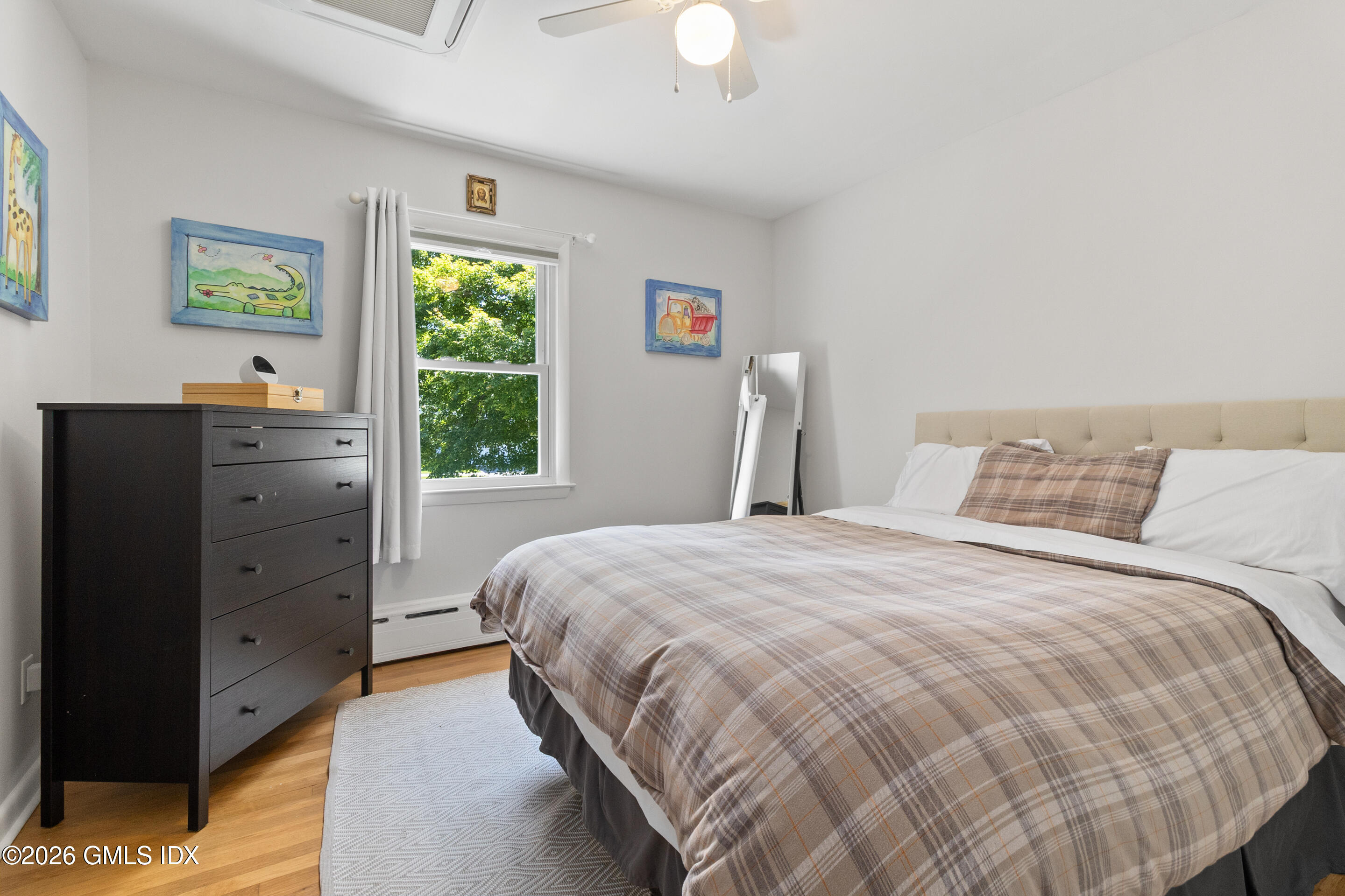 9 Deluca Drive Cos Cob, CT 06807 - Photo 16 of 30 a bedroom with a bed and a window