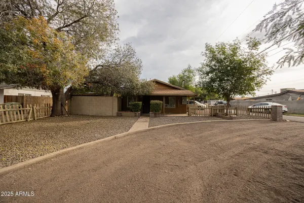 a front view of a house with a yard and a garage
