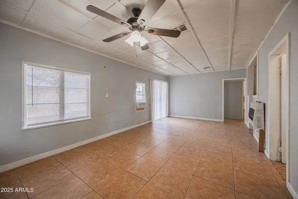 a kitchen with stainless steel appliances granite countertop a refrigerator and a stove
