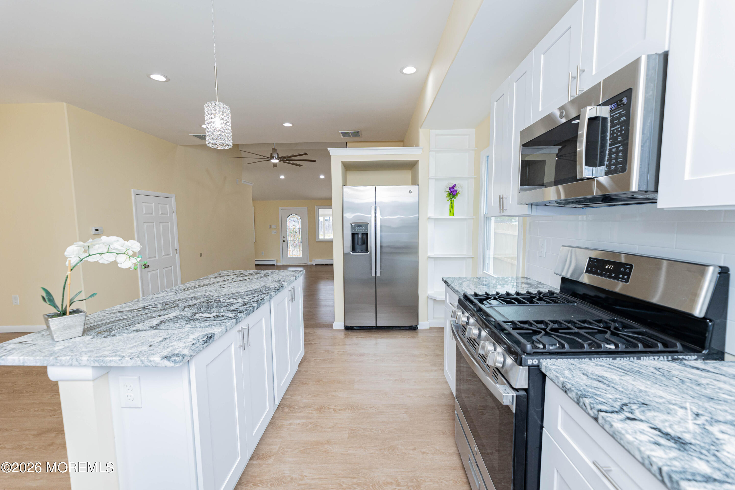 2408 Herbertsville Road Point Pleasant, NJ 08742 - Photo 8 of 82 a kitchen with stainless steel appliances granite countertop a stove a sink and a refrigerator