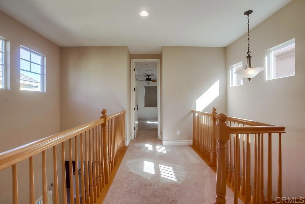 421 North Cedros Avenue Solana Beach, CA 92075 - Photo 23 of 54 a view of a hallway with a chandelier