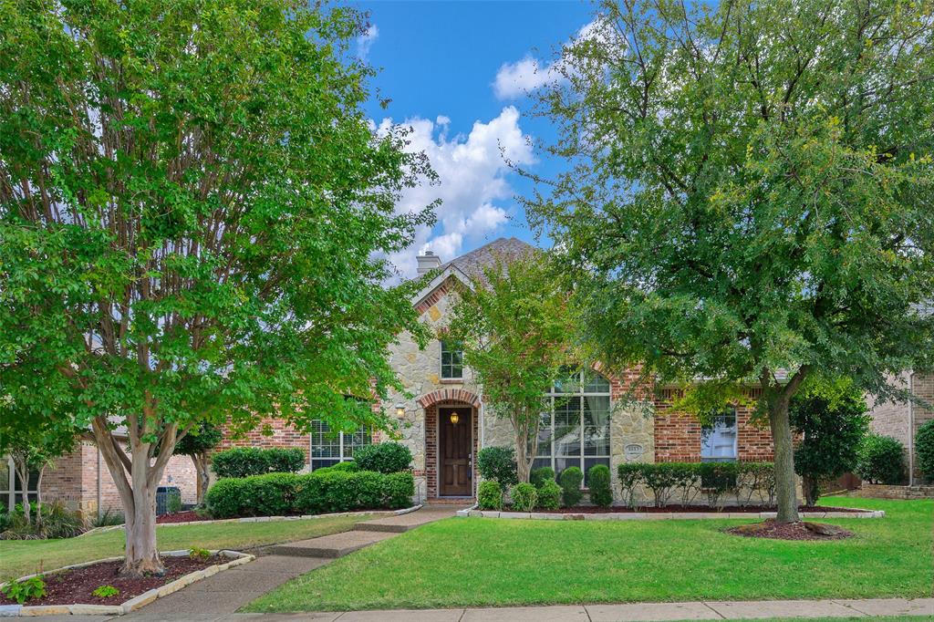 1815 Marshall Drive Allen, TX 75013 - Photo 1 of 1 a front view of a house with a garden