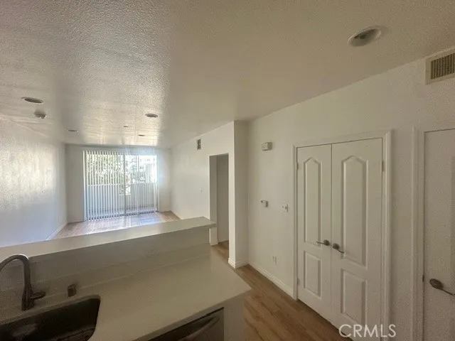 a view of a hallway with granite countertop a couch