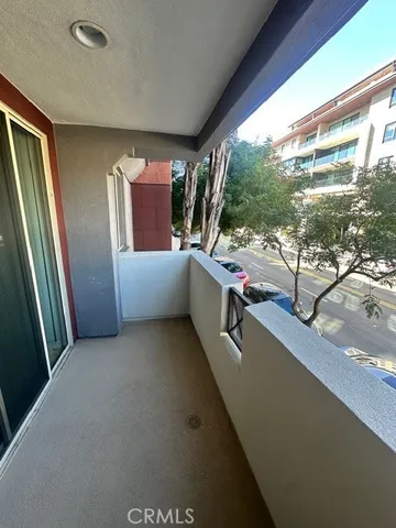 a view of a living room with a floor to ceiling window