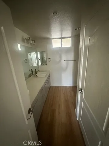 a view of a storage & utility room with a sink