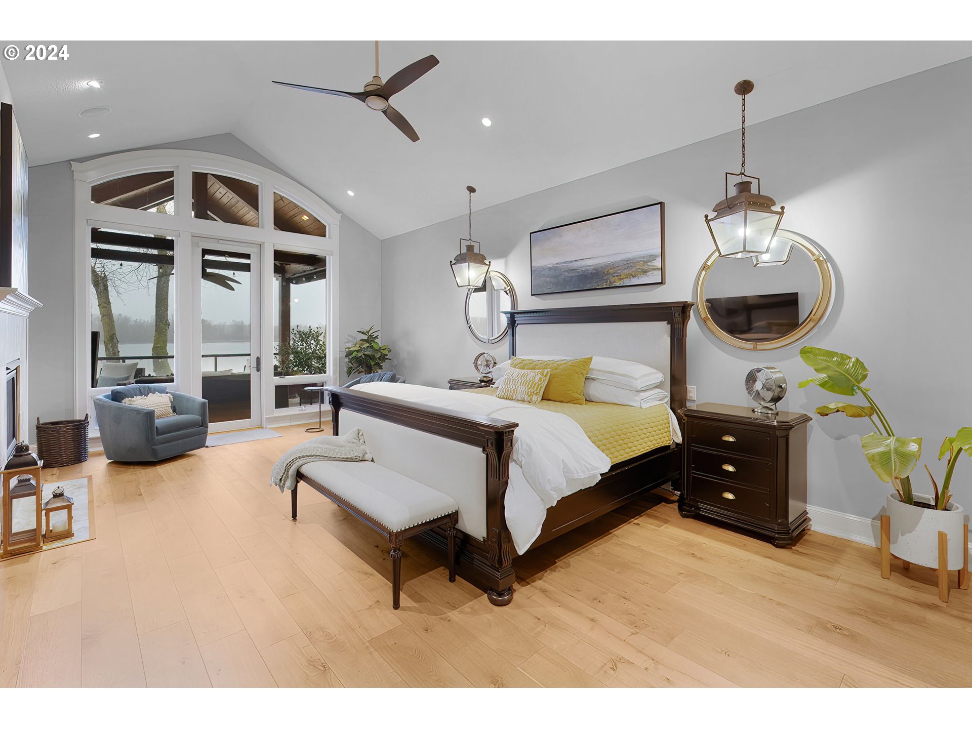 15421 Southeast Rivershore Drive Vancouver, WA 98683 - Photo 20 of 39 a spacious bedroom with a bed window and a chandelier