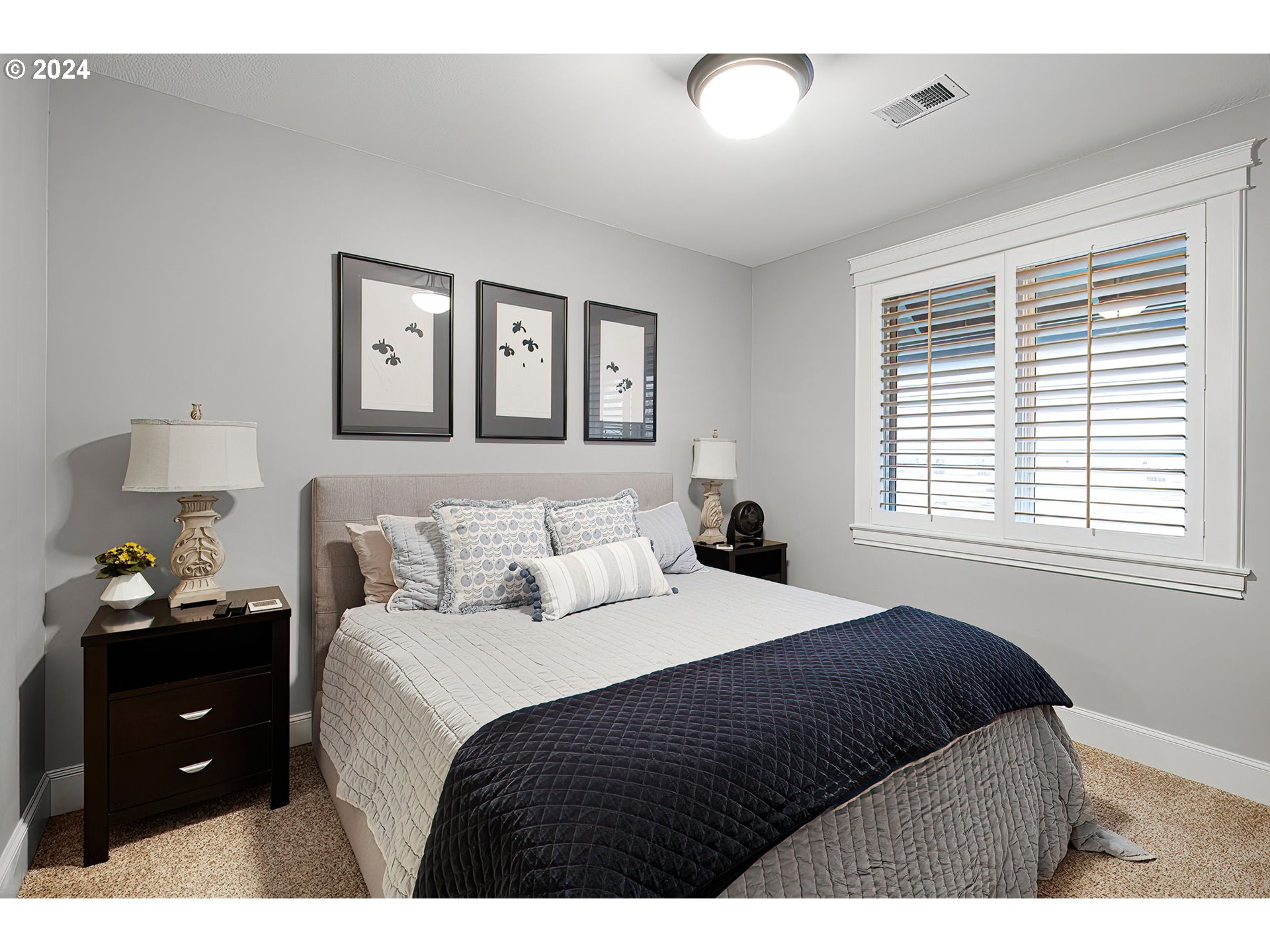 15421 Southeast Rivershore Drive Vancouver, WA 98683 - Photo 29 of 39 a bedroom with a bed and a window