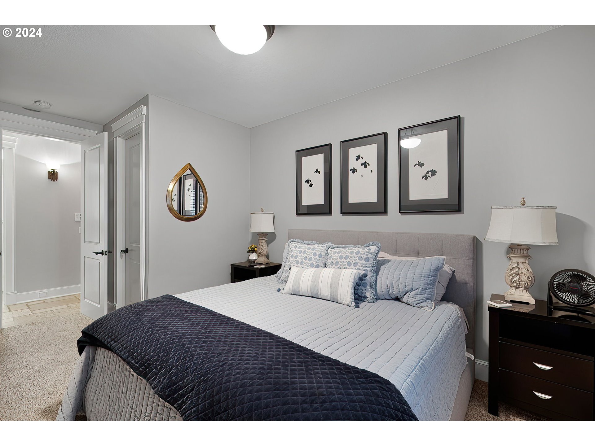 15421 Southeast Rivershore Drive Vancouver, WA 98683 - Photo 30 of 39 a bedroom with a bed and painting on the wall