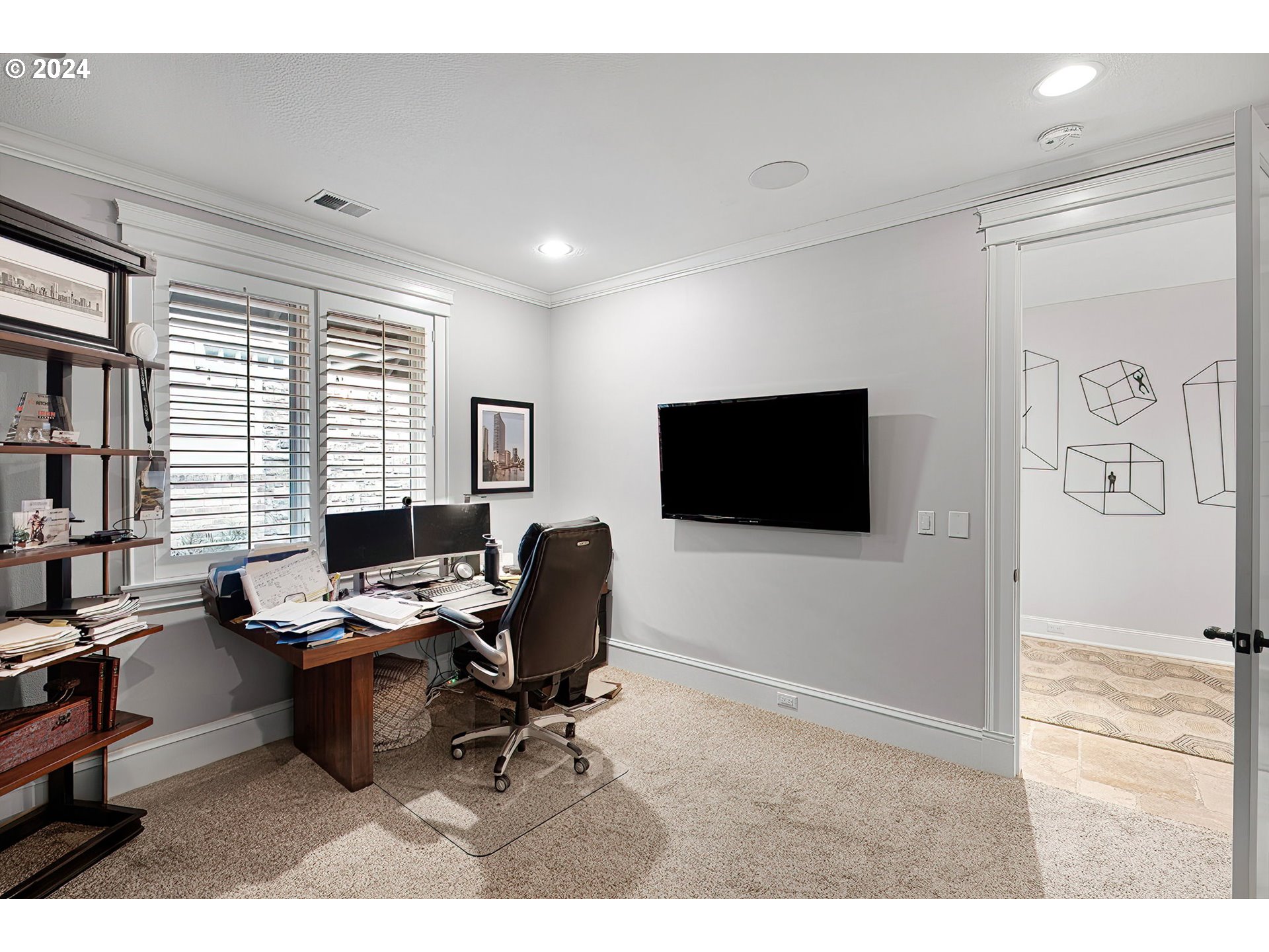 15421 Southeast Rivershore Drive Vancouver, WA 98683 - Photo 34 of 39 a workspace with furniture and a flat screen tv
