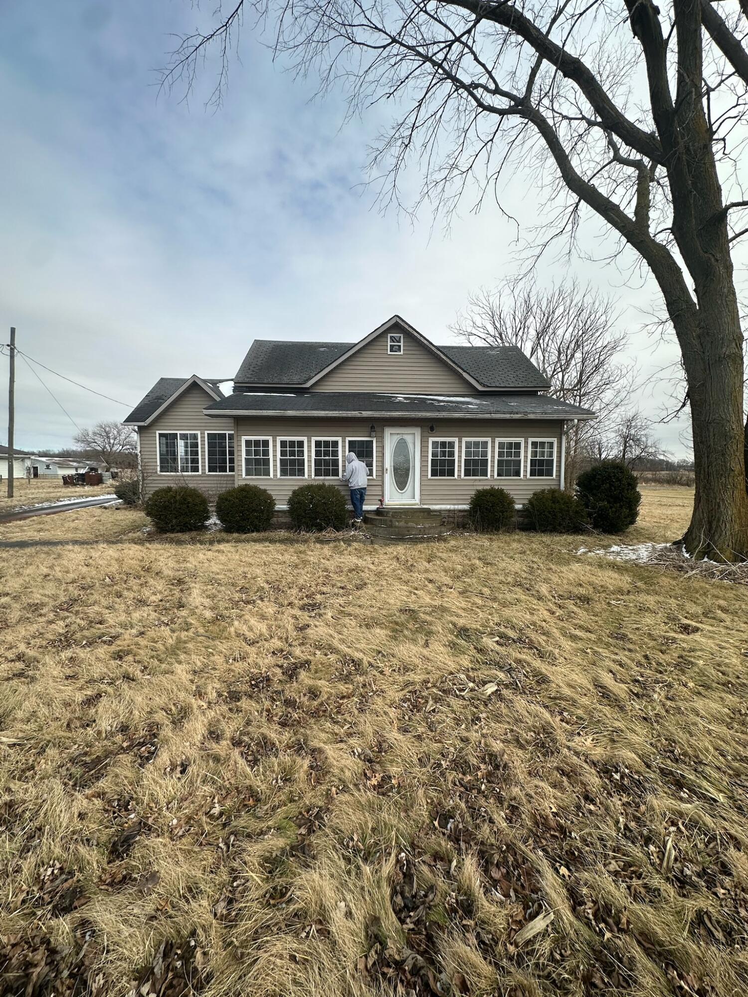 a view of residential houses with yard and covered with snow