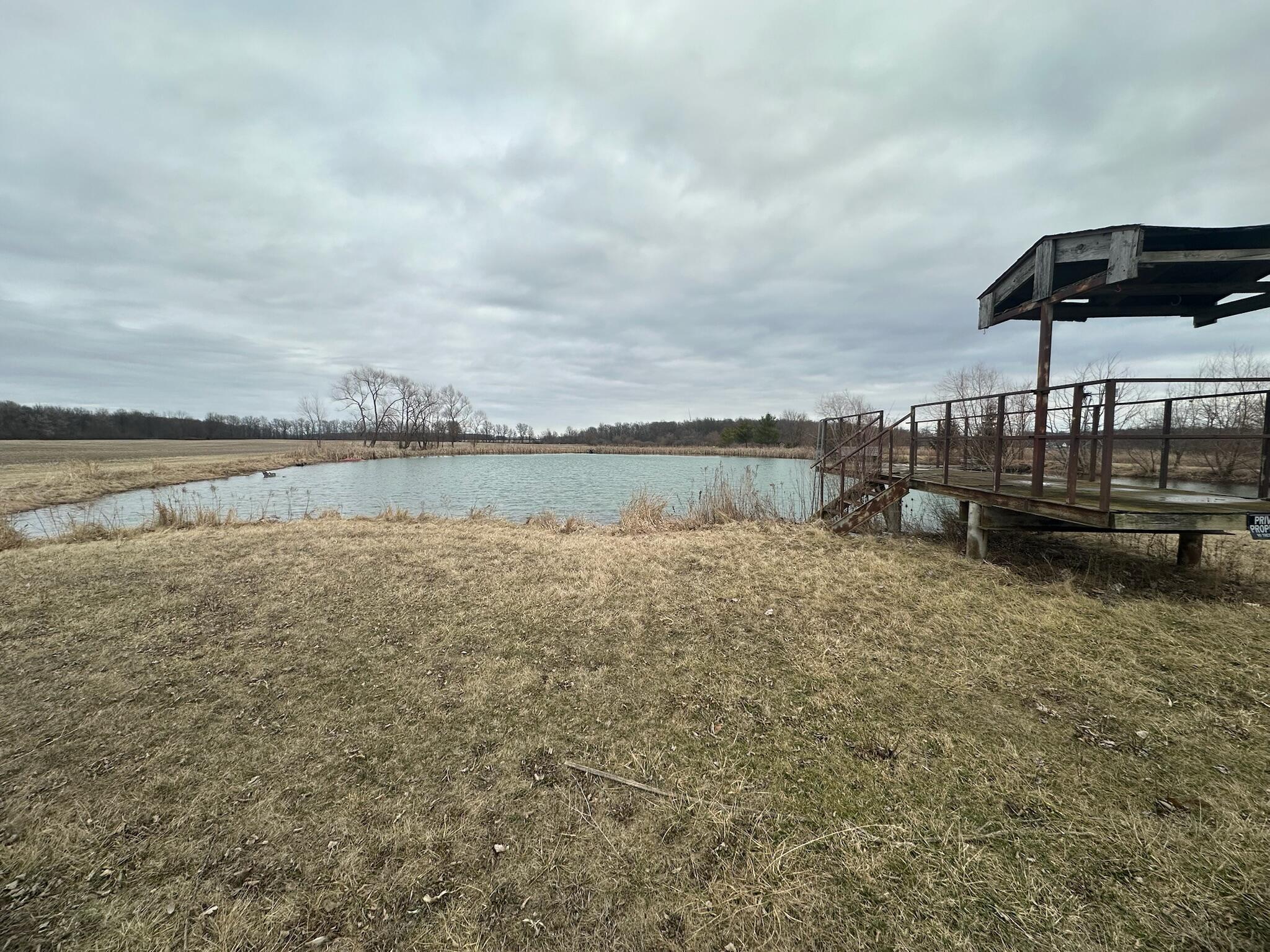 4701 South 1st Redkey, IN 47373 - Photo 27 of 29 a view of a lake with houses in the back