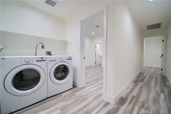 a utility room with sink dryer and washer
