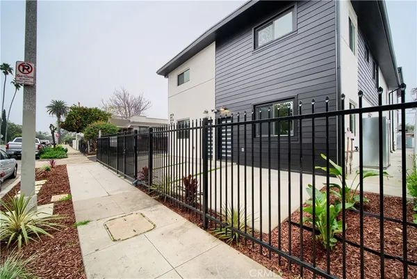 a view of a balcony with iron fence